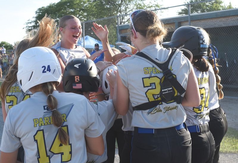 Ida players leap all over teammate Sadie Lusky was after blasting a two run homer over South Rockwood in the 51st annual Monroe County Fair Softball Tournament Championship game Thursday, July 10, 2025. The final score 8-4.