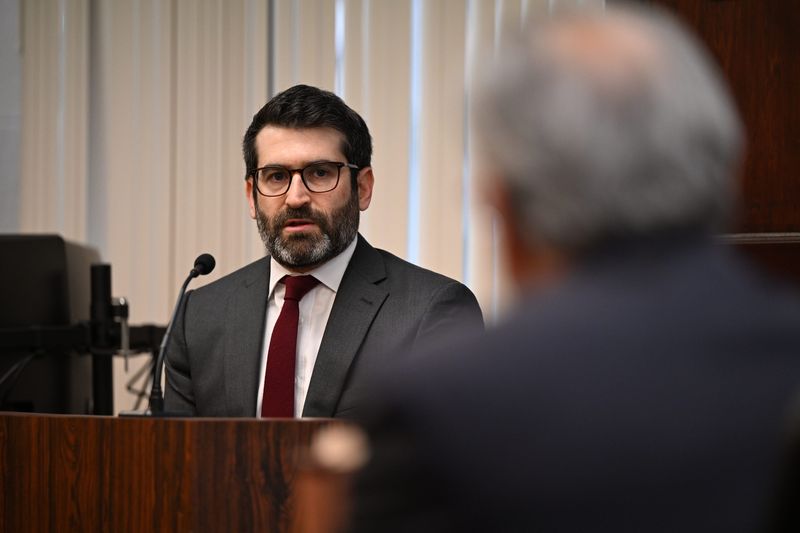 Michigan Burea of Elections Director Jonathan Brater is questioned by attorney Kurt Olsen, representing Oakland County attorney Stephanie Lambert and Adams Township Clerk Stephanie Scott who have been charged with a voter data breach stemming from the 2020 election. A Michigan judge dismissed the charges against Scott. There is no indication that Brater is under a federal investigation, according to a Secretary of State spokesperson.