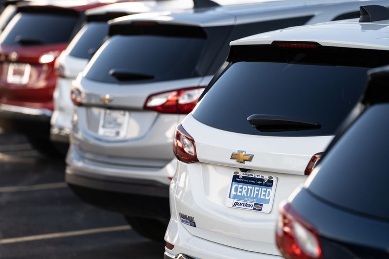 Pre-owned cars and trucks are parked in a lot at Gordon Chevrolet in Garden City on Monday, August 23, 2021.