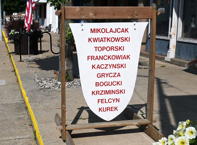 Signs with local Polish family names lines sidewalks along U.S. 12 in Bronson this week. The weekend begins Thursday night in St. Mary's school gym when the festival King, Queen, Princes, and Princesses are crowned.