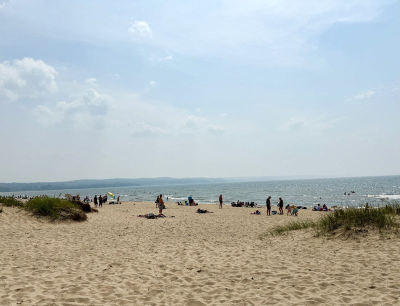 People fill the beach at Petoskey State Park on Sunday, July 13, 2025.