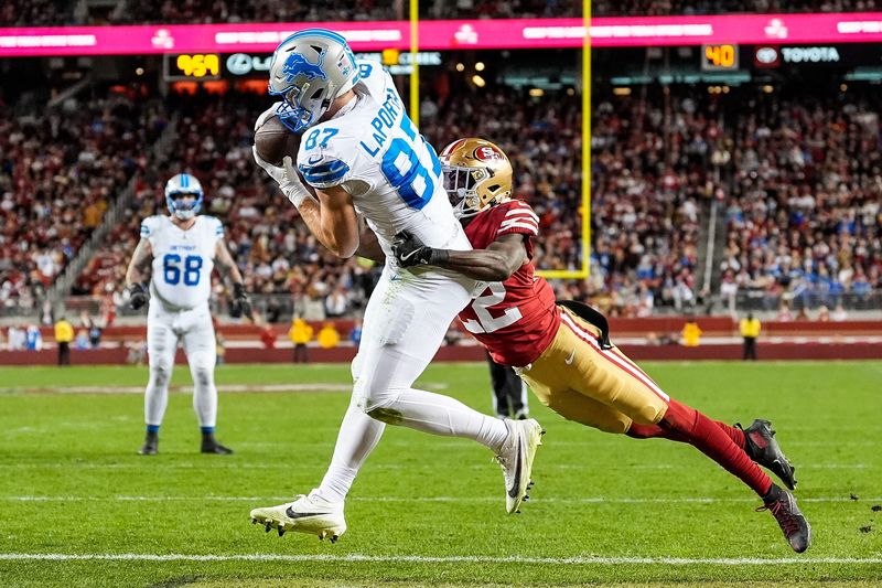 Detroit Lions tight end Sam LaPorta (87) makes a catch for a touchdown against San Francisco 49ers cornerback Isaac Yiadom (22) during the second half at Levi's Stadium in Santa Clara, Calif. on Monday, Dec. 30, 2024.