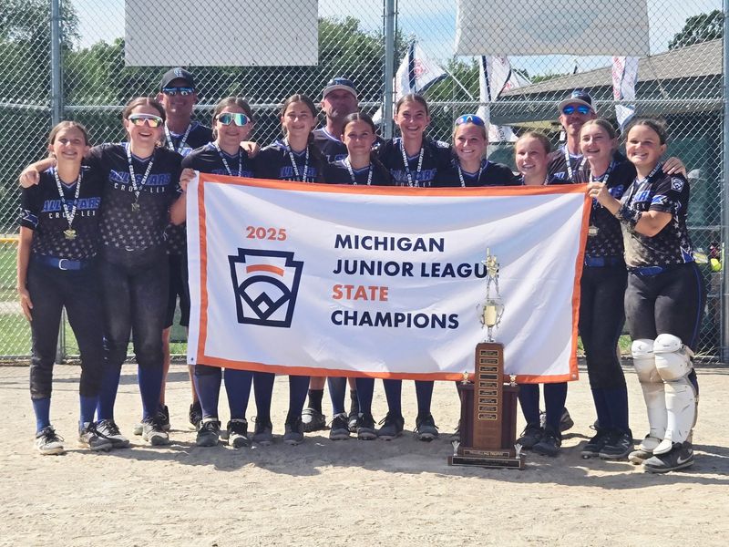 The Croswell-Lexington Little League softball team celebrates after winning the Michigan junior state championship in Kalamazoo on Thursday, July 10, 2025.
