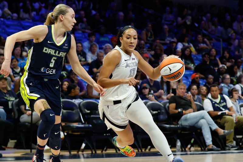 Jul 16, 2025; Arlington, Texas, USA; Las Vegas Aces guard Aaliyah Nye (13) drives to the basket as Dallas Wings guard Paige Bueckers (5) defends during the first half at College Park Center on July 16, 2025.