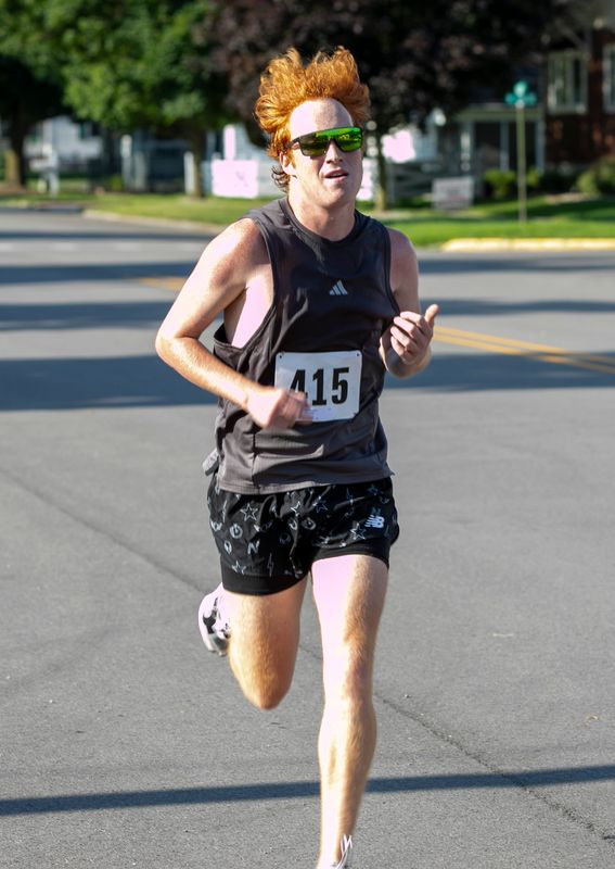 Men’s Open winner Evan Suydam of Toledo runs in the Rose Run in Petersburg on July 12, 2025.
