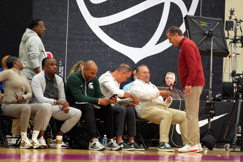 July 19, 2025; North Augusta, South Carolina, USA; Arkansas basketball coach John Calipari stands as he talks to Michigan State basketball coach Tom Izzo (right) during the Team Melo and NY Rens game at the Nike EYBL Peach Jam at Riverview Park Activity Center. The NY Rens won 68-57. Mandatory Credit: Katie Goodale - Augusta Chronicle/USA TODAY NETWORK