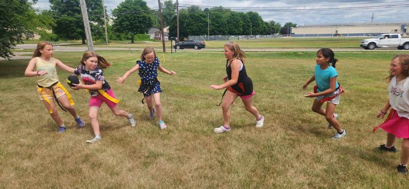 Local girls play flag football during the Y on the Fly program at the Monroe Family YMCA. The Y is debuting a full girls' flag football program this fall.