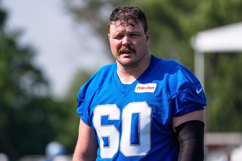 Detroit Lions guard Graham Glasgow (60) walks off the field after practice during training camp at Meijer Performance Center in Allen Park on Monday, July 21, 2025.