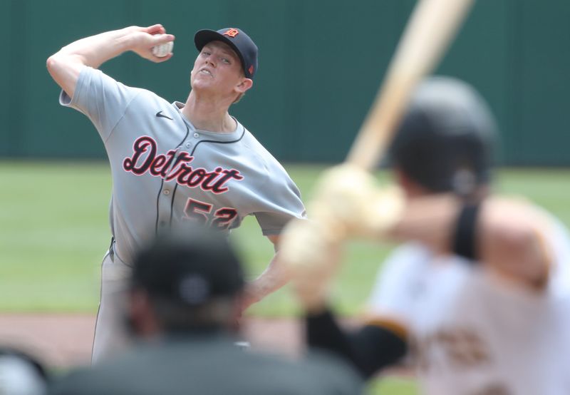 Detroit Tigers starting pitcher Troy Melton (52) delivers a pitch in his major league debut during the first inning against Pittsburgh Pirates right fielder Bryan Reynolds (10) at PNC Park in Pittsburgh on Wednesday, July 23, 2025.