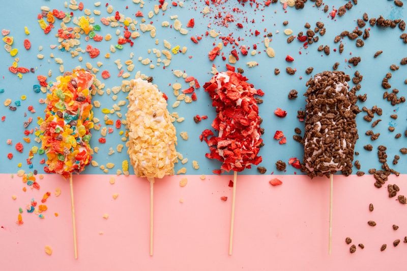 Frozen Banana Pops are rolled in yogurt and coated with crispy rice cereal or dried fruit.
