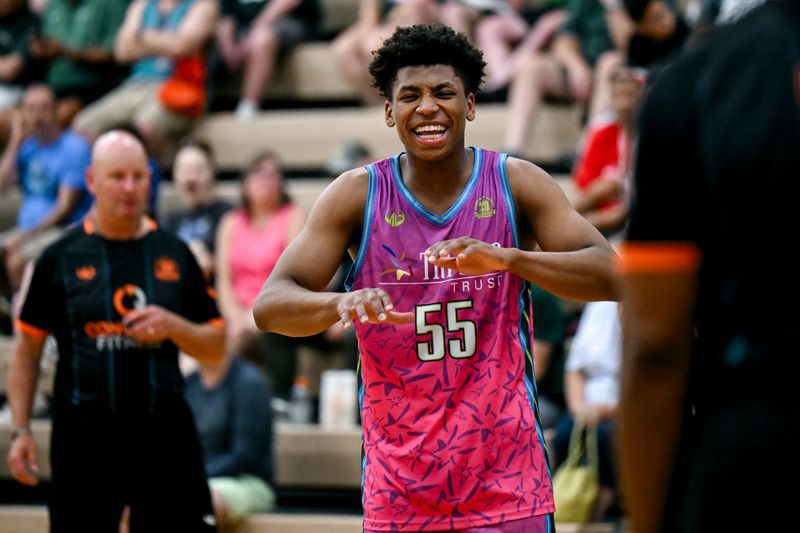 Team Tri-Star and Michigan State's Jeremy Fears jokes with a referee during the Moneyball Pro-Am on Thursday, July 24, 2025, at Holt High School.