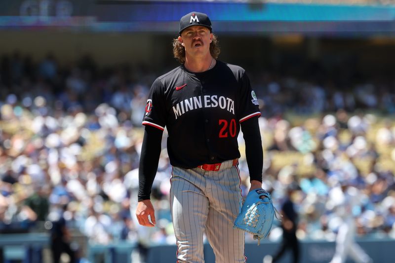 Minnesota Twins starting pitcher Chris Paddack walks back to the dugout after pitching sixth inning against the Los Angeles Dodgers at Dodger Stadium in Los Angeles on July 23, 2025.