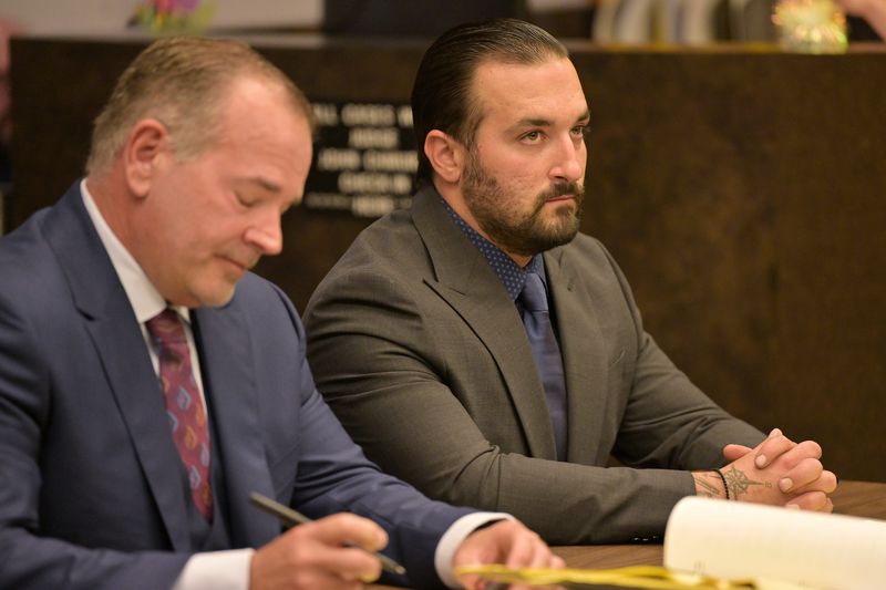 From left, Defense attorney Marc Curtis sits with his client James Burke during the preliminary exam for Warren police officer James Burke at 37th District Court in Warren, Mich. on Wednesday, July 30, 2025.