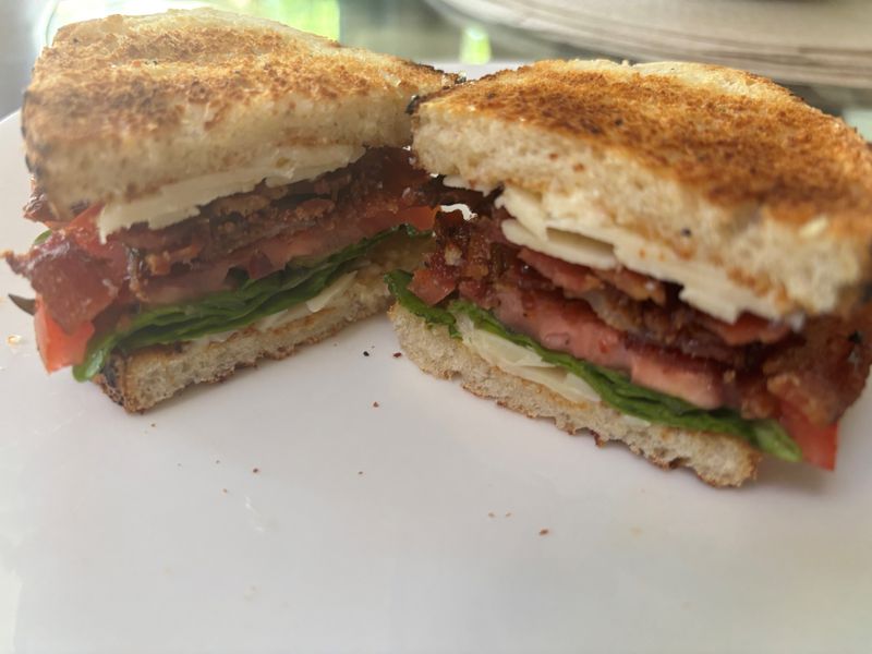 A tomato sandwich that celebrates homegrown tomatoes.