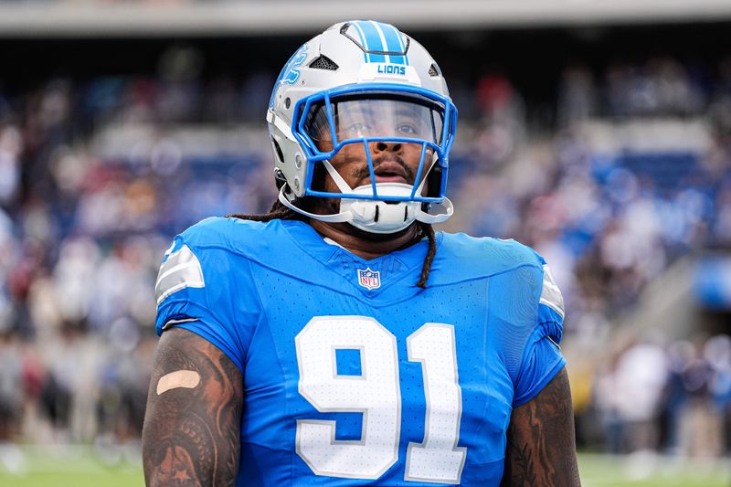 Detroit Lions defensive tackle Tyleik Williams (91) warms up ahead of the Hall of Fame Game at Tom Benson Hall of Fame Stadium in Canton, Ohio on Thursday, July 31, 2025.