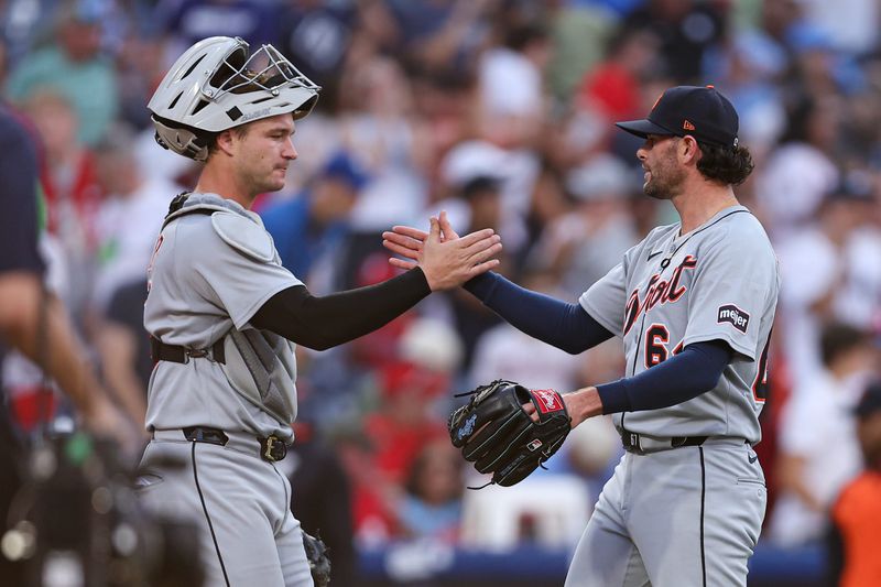 Detroit Tigers pitcher Kyle Finnegan (64) and catcher Dillon Dingler (13) shake hands after a victory against the Philadelphia Phillies at Citizens Bank Park in Philadelphia on Saturday, Aug. 2, 2025.