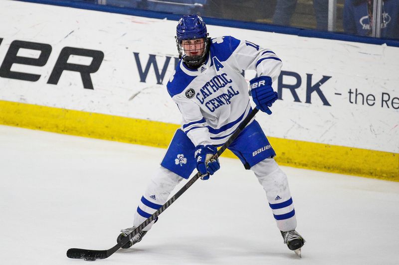 Novi Detroit Catholic Central forward Brooks Rogowski looks to pass against Brighton during the first period of the MHSAA Division 1 hockey final at USA Hockey Arena in Plymouth on Saturday, March 9, 2024.
