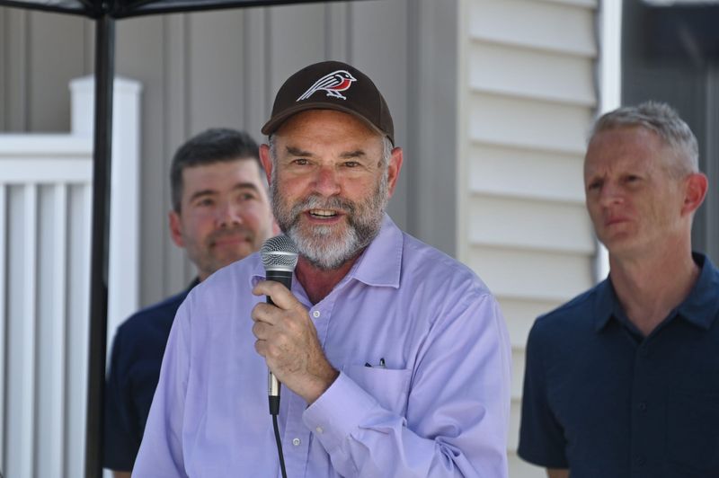 Alan Fox, chair of the Ingham County Land Bank and Ingham County Treasurer speaks Thursday, Aug. 7, 2025, during a community open house on featuring newly-renovated homes on Lansing's eastside.
