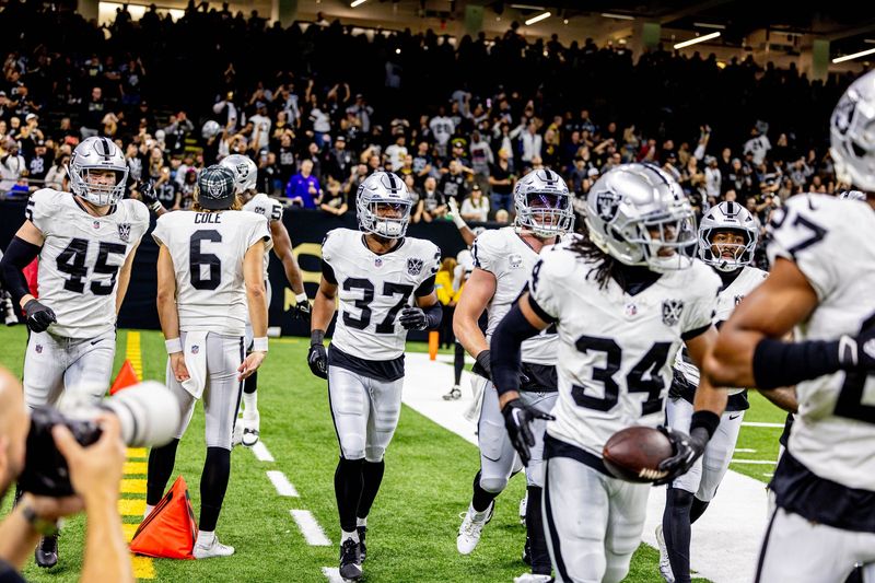 Dec 29, 2024; New Orleans, Louisiana, USA; Las Vegas Raiders safety Thomas Harper (34) celebrates after an interception against the New Orleans Saints during the second half at Caesars Superdome. Mandatory Credit: Stephen Lew-Imagn Images