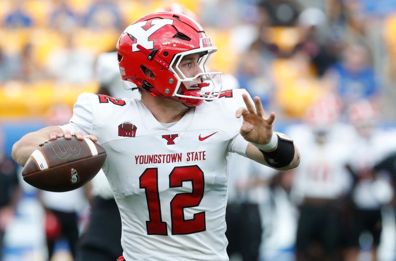 Sep 21, 2024; Pittsburgh, Pennsylvania, USA; Youngstown State Penguins quarterback Beau Brungard (12) passes against the Pittsburgh Panthers during the third quarter at Acrisure Stadium. Mandatory Credit: Charles LeClaire-Imagn Images