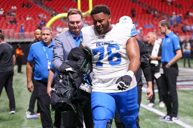 Aug 8, 2025; Atlanta, Georgia, USA; Detroit Lions offensive tackle Justin Herron (76) leaves the field with an injury before a game against the Atlanta Falcons at Mercedes-Benz Stadium. Mandatory Credit: Brett Davis-Imagn Images