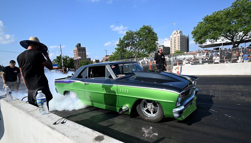 A drag racer warms up their tires before a heat during RoadKill Nights on Woodward Avenue in Pontiac on Saturday, Aug. 9, 2025.