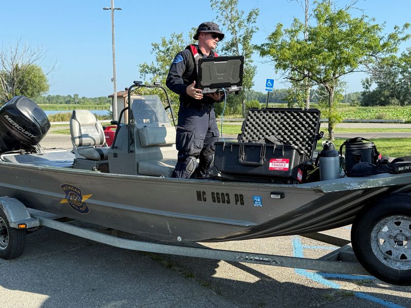 Michigan State Police ready their boat to continue the search.