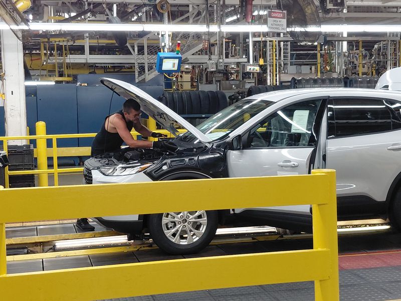 A Ford Motor Co. operator installs a part onto a vehicle at Louisville Assembly Plant. The automaker scored the biggest improvement in an annual survey of supplier relations but still has a low ranking.