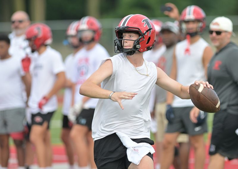 Dearborn Divine Child quarterback Drew Sheridan will visit Michigan for the Wolverines' spring game Saturday.