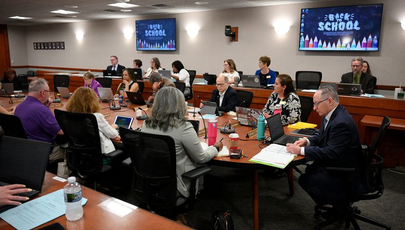 Dr. Michael Rice, seated at right, leads a meeting of the Michigan State Board of Education, on Tuesday, Aug 12, 2025.