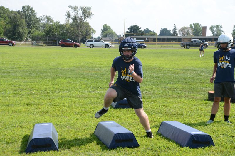 Kory Bondie runs an agility drill during Erie Mason football training camp on Tuesday, Aug. 12, 2025.