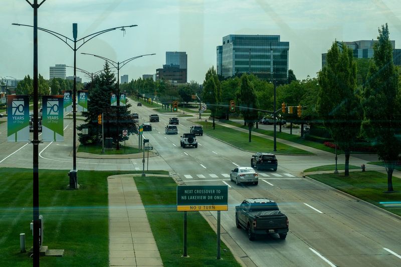 Cars drive through West Big Beaver Road in Troy on Tuesday, Aug. 12, 2025.