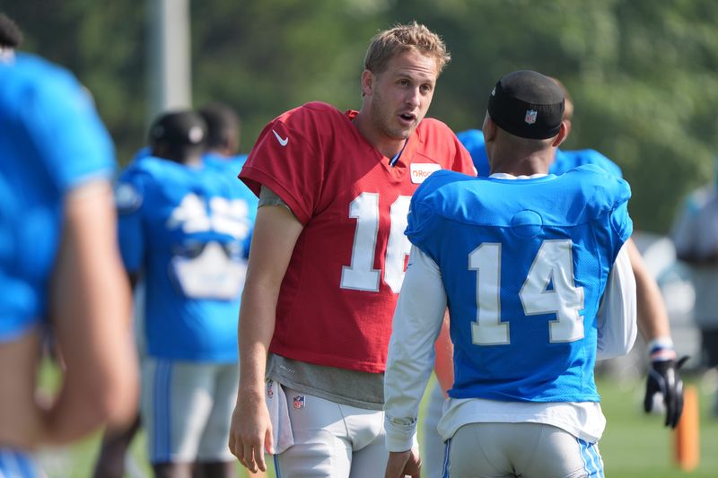 Detroit Lions QB Jared Goff talks with WR Amon-Ra St. Brown during practice at the Lions training facility in Allen Park, Thursday, Aug. 14 2025
