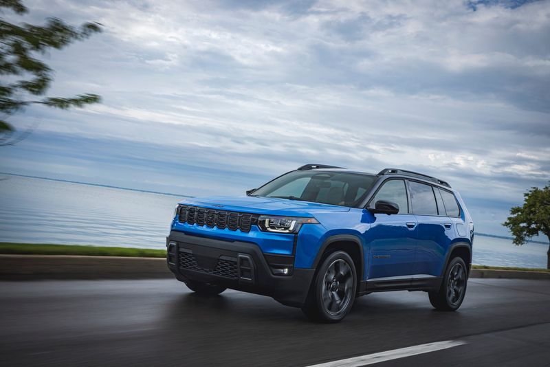 The 2026 Jeep Cherokee midsize SUV retains signature visual touches including a seven-slot grille and trapezoidal wheel arches.