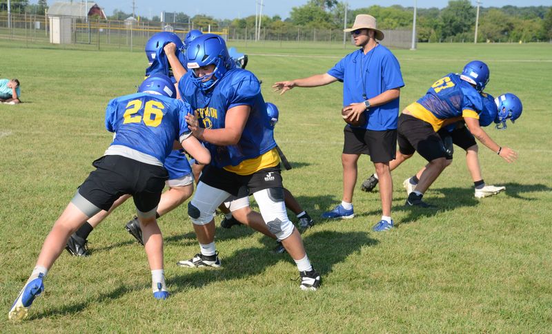 Jefferson offensive tackle Caiden Pfeiffer blocks teammate Gage Duvall (26) during a training camp workout on Friday, Aug. 15, 2025.
