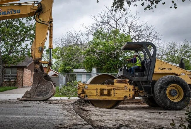 In this April 2023 file photo, construction workers prepare to pave a strip of Prescott Street near Gollihar Road.