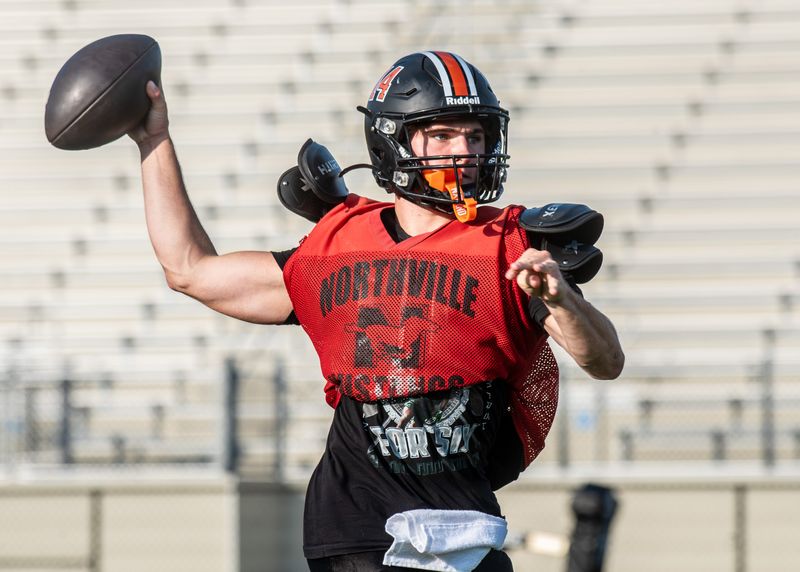 Northville's Cooper Derkach passes during a football practice on Monday, Aug. 18, 2025, at Tom Holzer Ford Field.