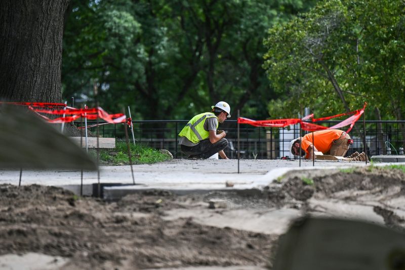 A crews work on upgrades to the Brenke Fish Ladder on Monday, Aug. 18, 2025, in Lansing.