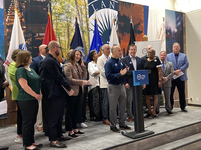 Lansing Mayor Andy Schor speaks at a news conference along with other mayors and state legislators who are part of a Michigan Municipal League group pushing for a new state funding of housing projects.