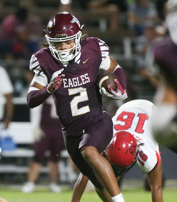 Eagle WR Justus Donahoo runs with ball during the Niceville - Bay preseason football game at Niceville.
