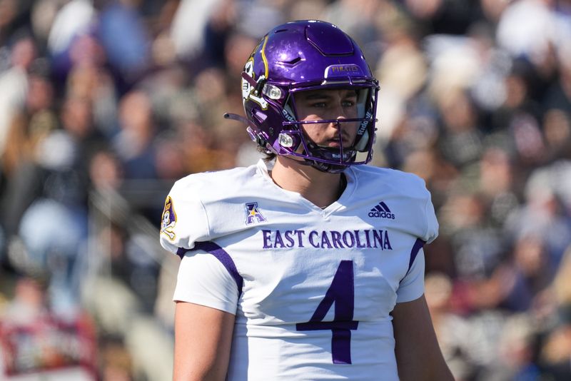 Oct 19, 2024; West Point, New York, USA; East Carolina Pirates quarterback Katin Houser (4) reacts during the first half against the Army Black Knights at Michie Stadium. Mandatory Credit: Lucas Boland-Imagn Images