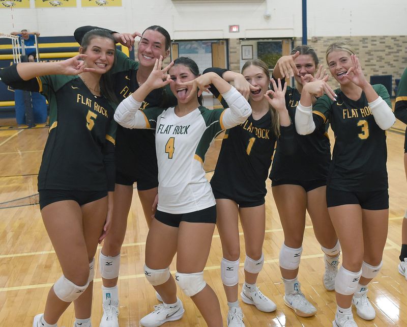 Flat Rock Rams volleyball players ham it up for the camera after they defeated Jefferson in the Erie Mason Volleyball Invitational on Thursday, August 21, 2025.