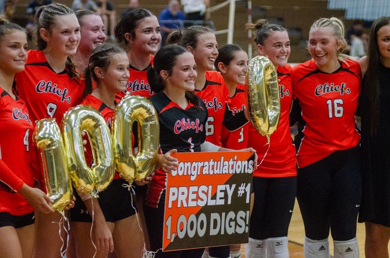 Alongside teammates, Cheboygan senior Presley Chamberlain was all smiles after reaching 1,000 career digs during a volleyball victory at Gaylord on Wednesday.