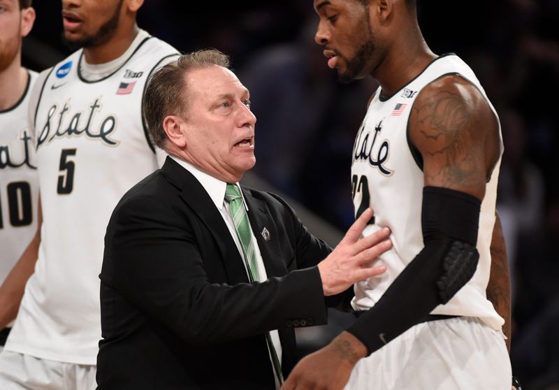 Mar 30, 2014; New York, NY, USA; Michigan State Spartans head coach Tom Izzo talks to Michigan State Spartans guard/forward Branden Dawson (22) during the first half against the Connecticut Huskies in the finals of the east regional of the 2014 NCAA Mens Basketball Championship tournament at Madison Square Garden. Mandatory Credit: Robert Deutsch-USA TODAY Sports