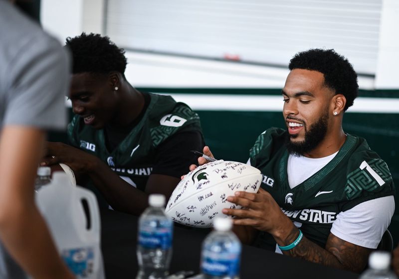 MSU's Nikai Martinez signs autographs, Thursday, Aug. 21, 2025, during the Meet the Spartans event at Spartan Stadium in East Lansing.