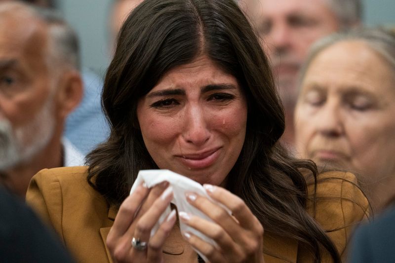 Jacqueline Reckling, wife of fallen Oakland County Sheriff deputy Bradley Reckling, wipes tears away after delivering her victim impact statement during the sentencing of Raymone Debose in the Wayne County Criminal Justice Center courtroom of Judge Charise Anderson on Friday, Aug. 22, 2025.