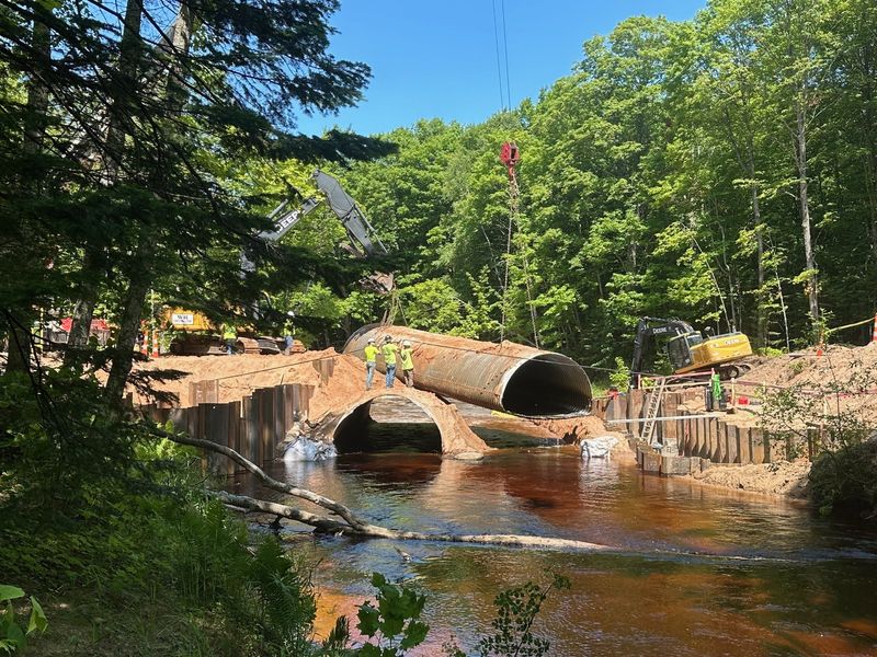A view of a culvert being removed from the Sucker River along H-58, east of Grand Marais, Michigan, and some of the work being completed on site.