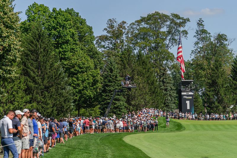 Fans line the ropes of No. 1 for an overtime match between Tyrrell Hatton and Richard Bland during the LIV Golf Michigan Team Championship Quarterfinals at The Cardinal at St. John’s in Plymouth on Friday, August 22, 2025.