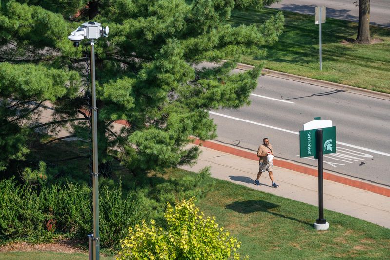 A Michigan State University Police Department camera overlooks a person on North Neighborhood on Michigan State University’s campus in East Lansing on Thursday, August 14, 2025.