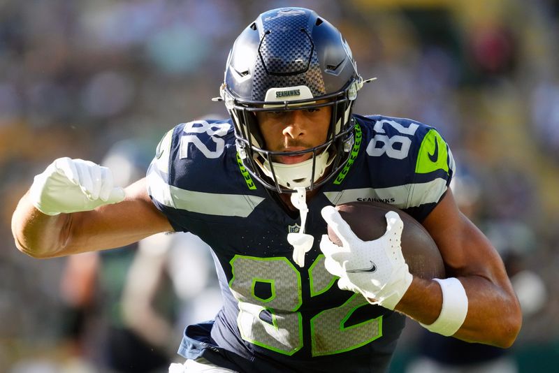 Aug 23, 2025; Green Bay, Wisconsin, USA; Seattle Seahawks wide receiver Cody White (82) scores a touchdown during the fourth quarter against the Green Bay Packers at Lambeau Field. Mandatory Credit: Jeff Hanisch-Imagn Images